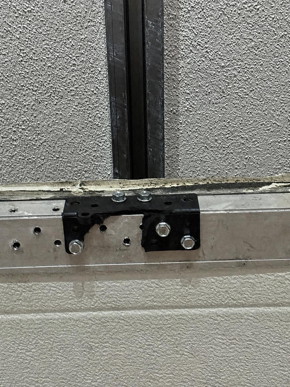 New steel bracket for a parking gate, mounted on the rail